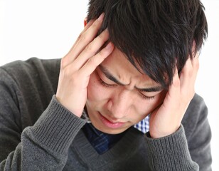 Fototapeta premium Stressed Young Man Suffering from Depression ストレスと鬱病に苦しむ若い男性