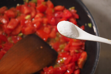 Cooking process with diced tomatoes and salt being added