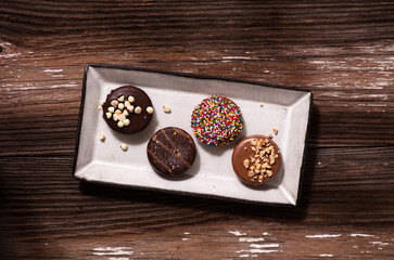 Four Gourmet Cookies on a rectangular plate