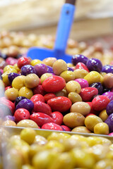Colorful variety of olives displayed at a market stall