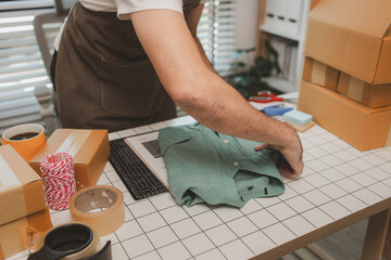 a small online business owner is checking boxes for accuracy before shipping to customers, parcel, an employee is packing products into boxes to prepare for shipping to customers