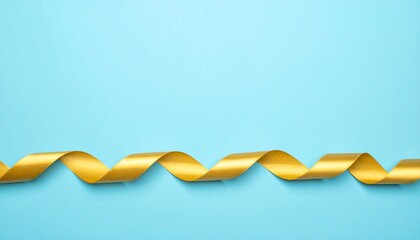 Isolated Gold ribbon on Pastel Blue Background with Copyspace 