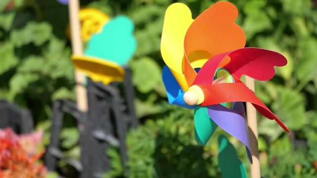 Colorful wind spinners brighten up the garden