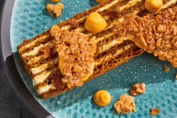 Medovik cake slice with honey cream, bright natural light, closeup composition