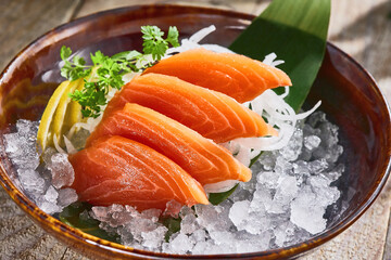 Salmon sashimi slices on ice, bright natural lighting, overhead composition, Japanese restaurant...