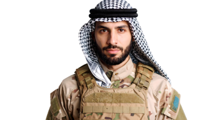 Middle Eastern soldier wearing keffiyeh and tactical vest