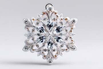 Close up of a decorative silver snowflake ornament with clear gemstones set in it on transparent background