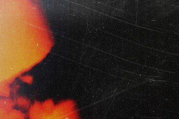 grungy black texture with vintage scratches and orange light leak for edgy web design, print media...