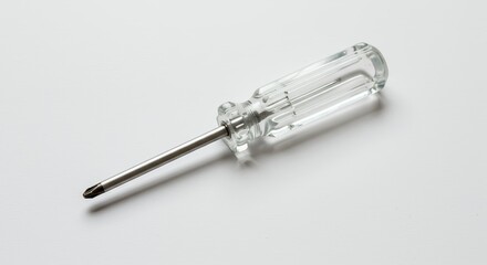 Small transparent screwdriver on white background