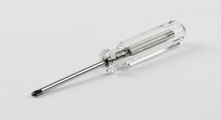 Small transparent screwdriver against white background