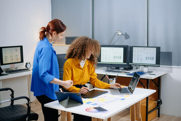 Creative UX UI design team collaborating on mobile interface in a bright tech office. Teamwork, planning, and modern workflow