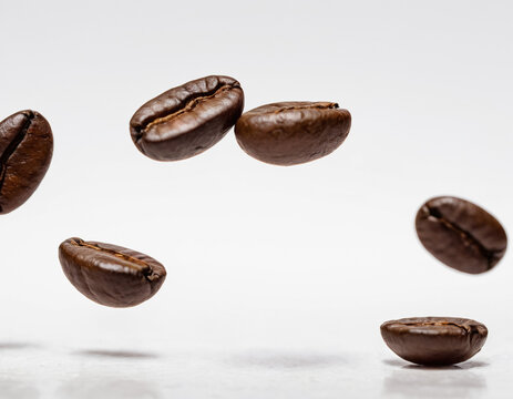 Bunch of Coffee Beans Floating and Flying on White Background, Dynamic Minimalist Coffee Concept