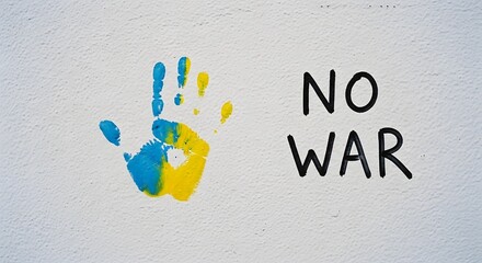 Colorful handprints of children's palms in various paint colors on a white background
