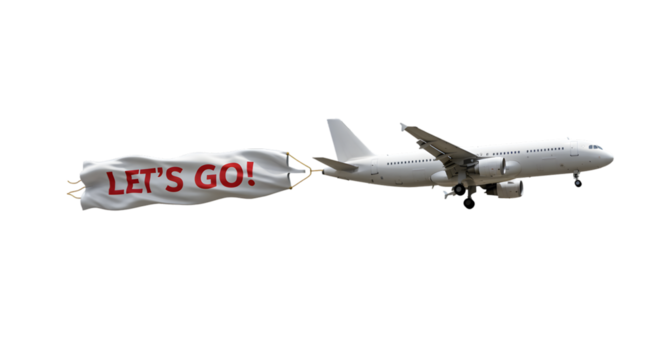 White plane with Lets Go banner flying against a black backdrop