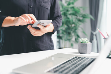 Closeup of woman holding smartphone hand shows using mobile phone technology browse online shopping, social media, engaging in fast-paced world of cyberspace. online shopping, social media network
