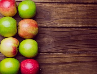 Red and green apples on table