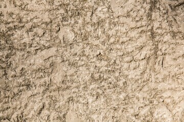 Textured rocky soil surface is being shown in flat design arid ground, highlighting fine cracks