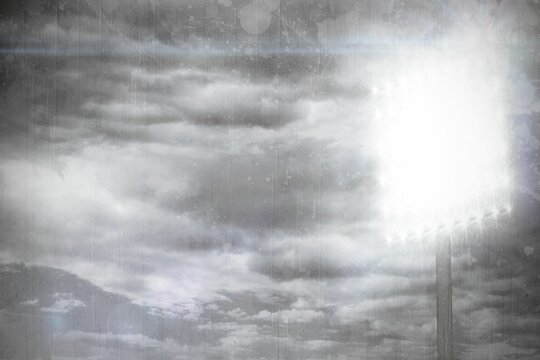 Fototapeta Floodlight tower is casting starburst lamps against dramatic layered clouds in flat design render