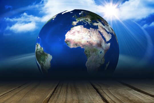 Fototapeta 3D render showing Earth globe floating above wooden plank, casting sun rays and scattered clouds