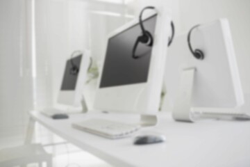Close-up of computers on table in office