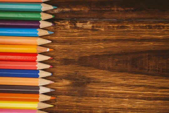 Color pencils on wooden table