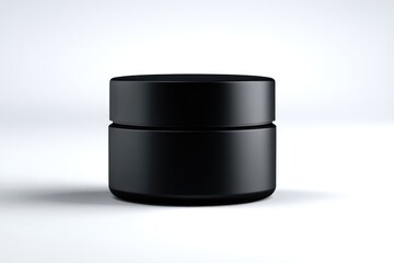Black cosmetic jar on plain background