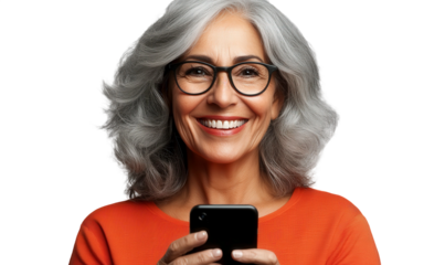 Cheerful Older Woman with Gray Hair Using Smartphone and Smiling in Bright Orange Top Against Black Background
