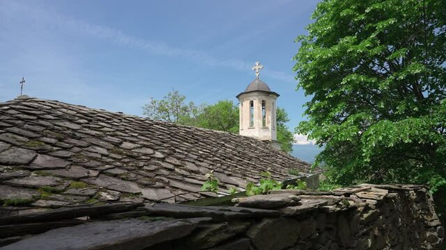 Bell Tower Of An Ancient Church Over A Mountain Village Of Kovachevitsa, Bulgaria. Dolly Shot