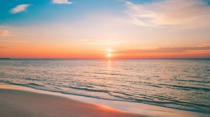 Obraz premium Sunset Serenity: Tranquil Beach Scene with Vibrant Sky and Gentle Waves