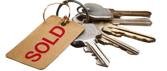 A close-up shot of a bunch of keys with a 'SOLD' tag, representing a property sale or transaction