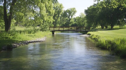 Obraz premium Serene River Landscape: Tranquil Bridge and Lush Greenery