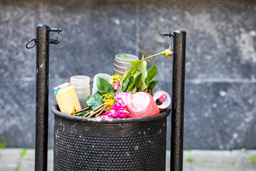 full trash can in the city outside. Environment