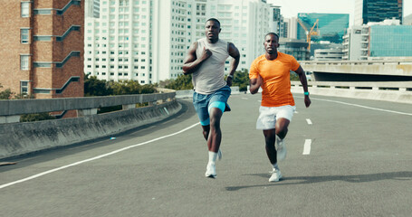 Fototapeta premium Running, race and fitness with black men in city for marathon, workout and training performance. Sports athlete, exercise and speed with African friends in street for challenge, cardio and wellness
