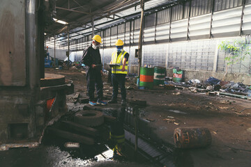 Liquid flowing in the factory. Chemical leak and safety first concept. Group of chemical specialist...
