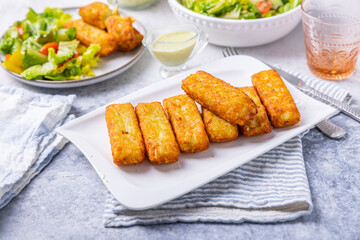 Fried potato pocked filled with cream cheese and herbs with mixed salad