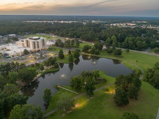 Fototapeta premium Aerial view of a hospital and Fairview Park, Dublin, Georgia, USA. The hospital provides medical care, while the park offers a space for recreation.