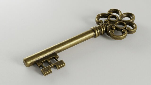 A vintage key with intricate design lying on a clean white surface