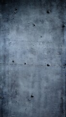 Dark grey concrete wall with metal bolts