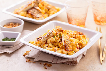 German egg dumplings with bacon, fried onions and grilled Halloumi cheese