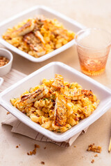 German egg dumplings with bacon, fried onions and grilled Halloumi cheese