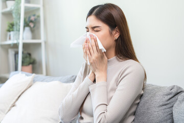 Sick, coronavirus or covid, tired asian young woman have a fever, flu and hand in use tissues paper...