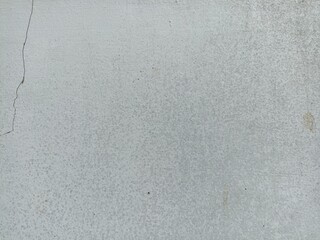 Cracked Light Gray Concrete Wall Texture. Light gray concrete surface with subtle speckled texture...