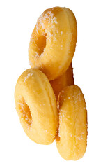Side view of brown sugar glazed cinnamon donuts in stack isolated with clipping path in png file format