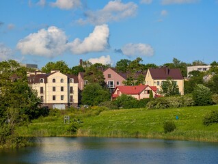 Lakeside houses surrounded by trees, ecologically clean area to live
