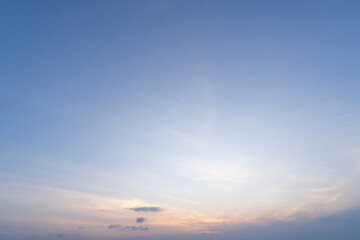 Low angle view and full frame of beautiful morning or evening blue and orange sky with cloudy while sunsets or sunrises taken at the sea used as natural blackground texture