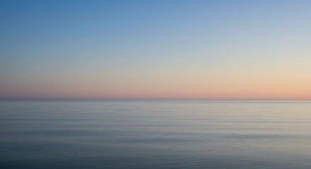 A calm ocean view with a minimal gradient blue sky