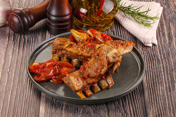 Baked lamb ribs with vegetables
