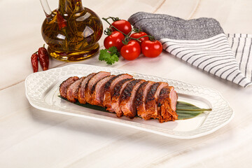 Sliced duck breast baked with cherry