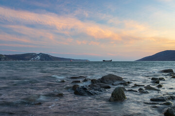 Nagaev Bay, Sea of ​​Okhotsk, Magadan Region, Russia. Beautiful evening seascape. Rocks in the...