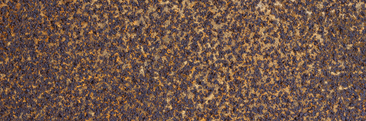 Texture of rusty metal. Rough metal surface with rust. Corroded and oxidized old iron. Rusted and aged metal sheet. Wide panoramic texture for background and design in grunge style.